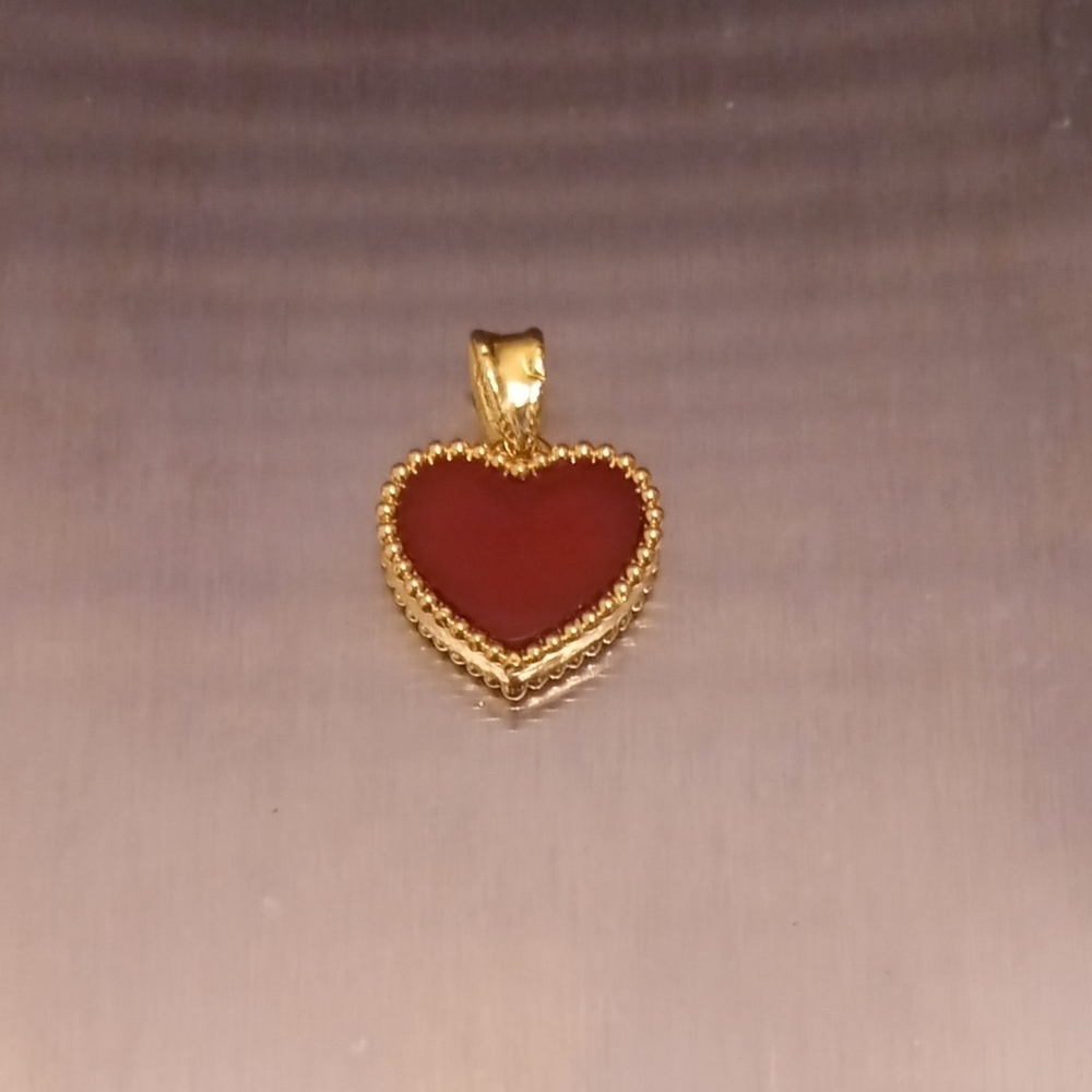 Solid 18k yellow gold vca heart pendant with red stone, new, stamped. Pretty!